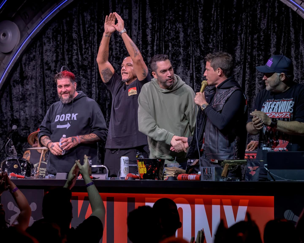 Episode #686 of Kill Tony brought the house down at the Comedy Mothership, with the Skankfest crew—Big Jay Oakerson, Luis J. Gomez, and Dave Smith—joining Tony Hinchcliffe and Brian Redban on stage. With an all-star panel, regular performers, and a series of memorable bucket pulls, the night was filled with laughs, surprises, and a few cringe-worthy moments. Here’s a breakdown of the highlights: Golden Ticket Winner Martin Phillips Sets the Tone Golden Ticket winner Martin Phillips opened the show with a hilariously well-received minute that had the crowd roaring. His interview kept the energy high, setting a strong start for the night and demonstrating why he earned his ticket to the Mothership stage. The Bucket Pulls: A Mixed Bag of Comedy and Chaos Will Eck was the first bucket pull and made his debut performance. While his comedy struggled, his candidness in the interview led to an entertaining segment where Tony gave him tickets to a Spurs game. A beautiful audience member, Riley, even came on stage to give him a kiss, sending him off with a big joke book as a consolation prize. Luke Stam followed with a risky yet hilarious minute centered around the “n-word,” managing to pull it off without losing the crowd. His interview was wild, revealing some personal stories that had the audience both cringing and laughing. Carly Anderson delivered a fun minute and an even better interview, where her honesty shone through. She proved that a straightforward, no-holds-barred approach is often the best route to an engaging interview on Kill Tony. Kam Patterson, one of the regulars, admitted to having a lackluster performance. While his set may have fallen short, he kept the interview lively, proving once again that his charisma shines through even on an off night. Ya Boi Cheech had what can only be described as an on-stage meltdown, which led to boos from the audience. His painful interview was reminiscent of pulling teeth, making it one of the more uncomfortable moments of the night. Sellina Ubious brought a strong stage presence, delivering a top-notch minute that captivated the audience. Her interview showed off her comedic prowess and ease with riffing alongside the pros. For only six months of experience, she proved herself to be a rising talent to watch. Hector Sifuentes gave an okay set and followed up with an interesting interview that, while not exceptional, kept the show’s momentum going. Conner Laughren, a six-year comedy veteran, delivered a hilarious minute and an engaging interview. His bold claim of being able to play the guitar led to an impromptu blues performance, singing about the Legion of Skanks. Conner impressed so much that Luis J. Gomez invited him to perform at Skankfest in Las Vegas and awarded him a large joke book. Andrew Packer, a seasoned Canadian comic with nine years of experience, absolutely killed with his set. He delivered joke after joke, each hitting hard with the audience. His fantastic interview led to a large joke book and a spot on The Secret Show, along with a quick open mic spot in front of Adam Egert. Jessica Misatano continued the streak of high-quality performances with a strong minute and a funny interview. She attempted to sing an Amy Winehouse song, and despite missing the mark musically, she still managed to make the segment amusing. William Montgomery Closes with a Bang Kill Tony Hall of Famer William Montgomery wrapped up the night with his usual chaos, delivering a heavy metal song that had the crowd fully engaged. His interview, as always, was eccentric and entertaining, making him the perfect closer for a jam-packed night of comedy. Special guest UFC fighter Dustin Poirier joined him on stage in a pre-rehearsed bit, adding a unique twist to the evening. Panel Highlights Big Jay Oakerson was the standout guest of the night, consistently funny and keeping the crowd engaged throughout the episode. Luis J. Gomez had some great moments, including offering Conner a Skankfest spot, but had a few misses as well. Dave Smith was noticeably quieter, contributing less than expected, yet the balance from the rest of the panel kept the episode lively. Final Thoughts This episode of Kill Tony delivered nonstop laughs, thanks to an exceptional panel and a strong lineup of bucket pulls. Tony Hinchcliffe was in top form, and Brian Redban’s quick wit and clever remarks kept things moving smoothly. With Big Jay Oakerson’s standout performance and a surprise appearance by Dustin Poirier, Episode #686 will be remembered as one of the funniest and most action-packed shows in recent Kill Tony history.